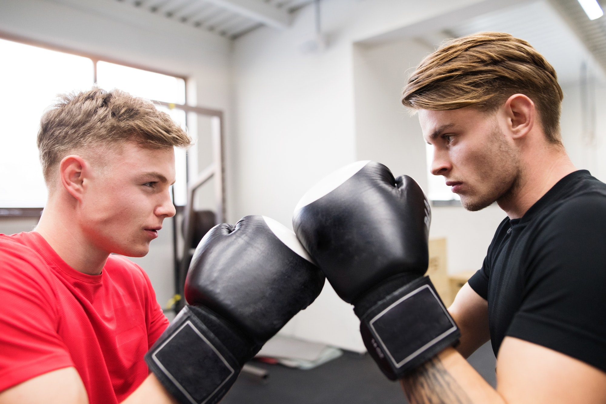 two-fit-handsome-men-in-gym-boxing-.jpg